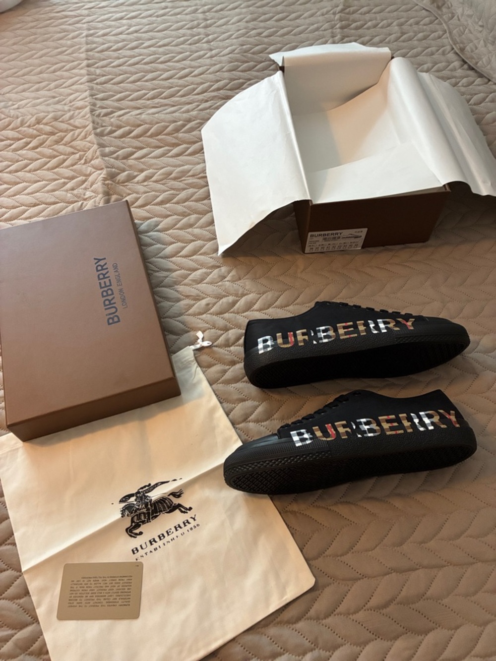 Black Slip-On Sneakers with Multicolor Logo that say Burberry